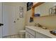 Bathroom featuring tile flooring, a white vanity and mirror, and a toilet at 631 Woodlawn Dr, Bradenton, FL 34210