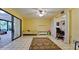 Bedroom with tile floors, ceiling fan, closet, and sliding glass doors at 631 Woodlawn Dr, Bradenton, FL 34210