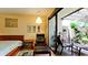 This bedroom retreat features an outdoor lounge area with a garden view at 631 Woodlawn Dr, Bradenton, FL 34210