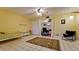 Bedroom featuring tile floors, ceiling fan, spacious closet, and bright window at 631 Woodlawn Dr, Bradenton, FL 34210