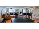Open living room with hardwood floors and a large sliding glass door leading to the patio at 631 Woodlawn Dr, Bradenton, FL 34210
