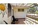 Inviting patio area with a privacy fence, trellis, and seating, perfect for relaxing outdoors at 631 Woodlawn Dr, Bradenton, FL 34210