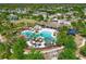 Aerial view of a pool area with lush landscaping and seating in the Cypress Creek community at 6723 Trent Creek Dr, Sun City Center, FL 33573