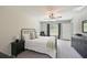 Comfortable bedroom with a ceiling fan, natural light, and carpet flooring at 6723 Trent Creek Dr, Sun City Center, FL 33573