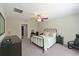 Cozy bedroom features a ceiling fan, carpet flooring, and ample space for relaxation and rest at 6723 Trent Creek Dr, Sun City Center, FL 33573