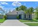 Charming one-story home with well-manicured lawn, inviting curb appeal, and a two car garage at 6723 Trent Creek Dr, Sun City Center, FL 33573