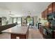 Bright, open kitchen with an island, stainless steel appliances, and seamless flow into the dining area at 6723 Trent Creek Dr, Sun City Center, FL 33573