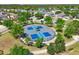 Aerial view of the community pickleball court surrounded by lush landscaping and well-maintained homes at 6723 Trent Creek Dr, Sun City Center, FL 33573