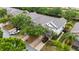 Aerial view of townhomes with well-manicured lawns and landscaping, showcasing curb appeal at 7180 83Rd E Dr # 6-5, Bradenton, FL 34201