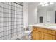 Cozy bathroom featuring a shower with a plaid curtain, and wood vanity at 7180 83Rd E Dr # 6-5, Bradenton, FL 34201