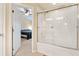 Bathroom with a bathtub and shower with a clear glass door at 7180 83Rd E Dr # 6-5, Bradenton, FL 34201