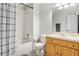 Cozy bathroom featuring a shower with a plaid curtain, and wood vanity at 7180 83Rd E Dr # 6-5, Bradenton, FL 34201