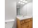 Well-lit bathroom featuring a vanity with wood cabinets and a large mirror at 7180 83Rd E Dr # 6-5, Bradenton, FL 34201
