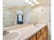 Bright bathroom with double sinks and natural light, conveniently located to the bedroom at 7180 83Rd E Dr # 6-5, Bradenton, FL 34201