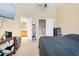 Spacious bedroom with high ceilings, ensuite bathroom, closet, and access to the upstairs hallway at 7180 83Rd E Dr # 6-5, Bradenton, FL 34201