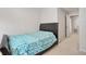 Cozy bedroom featuring a leather headboard and geometric patterned bedding at 7180 83Rd E Dr # 6-5, Bradenton, FL 34201