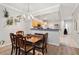 Traditional dining room featuring wood table and chairs with chandelier lighting and view into kitchen at 7180 83Rd E Dr # 6-5, Bradenton, FL 34201