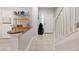Inviting entryway with tile flooring, staircase, and a decorative shelf with countertop at 7180 83Rd E Dr # 6-5, Bradenton, FL 34201