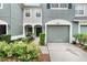 Charming townhome features a well-manicured landscape, a covered entryway, and an attached single-car garage at 7180 83Rd E Dr # 6-5, Bradenton, FL 34201