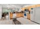 Well-lit kitchen with granite countertops, white appliances, and easy access to the comfortable living area at 7180 83Rd E Dr # 6-5, Bradenton, FL 34201