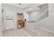 Bright kitchen with tile flooring, a functional layout, and convenient access to the adjacent rooms at 7180 83Rd E Dr # 6-5, Bradenton, FL 34201
