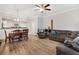 Open-concept living and dining areas with comfortable seating and wood-style flooring at 7180 83Rd E Dr # 6-5, Bradenton, FL 34201
