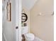 Well-maintained powder room with toilet, shelving, and neutral wall color at 7180 83Rd E Dr # 6-5, Bradenton, FL 34201