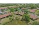 Gorgeous villa located in a golf community featuring a serene lake and lush landscaping at 7269 Golf Pointe Way, Sarasota, FL 34243