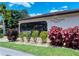 Exterior shot of community clubhouse with a pool view, showcasing well-maintained landscaping at 7269 Golf Pointe Way, Sarasota, FL 34243