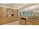 Stylish kitchen with granite counters, built-in appliances, and open layout to the living area at 7269 Golf Pointe Way, Sarasota, FL 34243