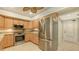 Well-equipped kitchen with stainless steel appliances, tile backsplash, and plenty of cabinetry at 7269 Golf Pointe Way, Sarasota, FL 34243