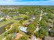 Aerial view of the property featuring a pool, landscaping, and surrounding residential area and lakes at 7299 S Leewynn Dr, Sarasota, FL 34240