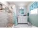 Updated bathroom with marble accents, a glass-enclosed shower, and a modern vanity at 7299 S Leewynn Dr, Sarasota, FL 34240