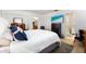 Cozy bedroom featuring a comfortable bed, television, and ensuite bathroom access at 7299 S Leewynn Dr, Sarasota, FL 34240