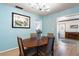 Cozy dining room with seating for four and light blue walls at 7299 S Leewynn Dr, Sarasota, FL 34240