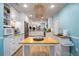 Bright kitchen with an island and stainless steel appliances, perfect for cooking at 7299 S Leewynn Dr, Sarasota, FL 34240