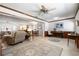 Bright living room featuring neutral color palette, wood trim, and updated flooring at 7299 S Leewynn Dr, Sarasota, FL 34240