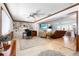 Comfortable living room boasting built-in shelving, modern furniture, and abundant natural light at 7299 S Leewynn Dr, Sarasota, FL 34240