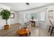 Bright and airy living room featuring neutral tones, large windows, and a cozy seating area for relaxation at 7299 S Leewynn Dr, Sarasota, FL 34240