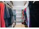 Spacious walk-in closet with ample storage, shelving, and organized clothing racks at 7299 S Leewynn Dr, Sarasota, FL 34240