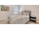 Bedroom with soft carpet, neutral walls, and a window bringing in natural light at 7407 Green St, Bradenton, FL 34201