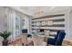 Stylish dining room showcasing gray and white striped accent wall, a glass table, and statement lighting fixture at 7407 Green St, Bradenton, FL 34201