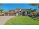 Beautiful single-Gathering home featuring a manicured lawn and a three-car garage at 7407 Green St, Bradenton, FL 34201