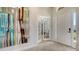 Inviting foyer entrance with stylish tile flooring and double french doors leading to the home office at 7407 Green St, Bradenton, FL 34201