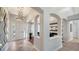 Inviting foyer with tile flooring, high ceilings, and stylish light fixture at 7407 Green St, Bradenton, FL 34201