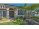 Close-up of front door with beautiful landscaping and a paver walkway at 7407 Green St, Bradenton, FL 34201