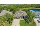 Beautiful front exterior with a three-car garage, well-manicured lawn, and attractive landscaping at 7407 Green St, Bradenton, FL 34201