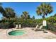 Relaxing hot tub with lounge chairs and lush landscaping at 7407 Green St, Bradenton, FL 34201