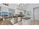 Well-lit kitchen featuring granite countertops, stainless steel appliances, and ample cabinet space at 7407 Green St, Bradenton, FL 34201