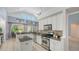 Spacious kitchen boasts granite countertops, modern appliances, and plenty of natural light at 7407 Green St, Bradenton, FL 34201